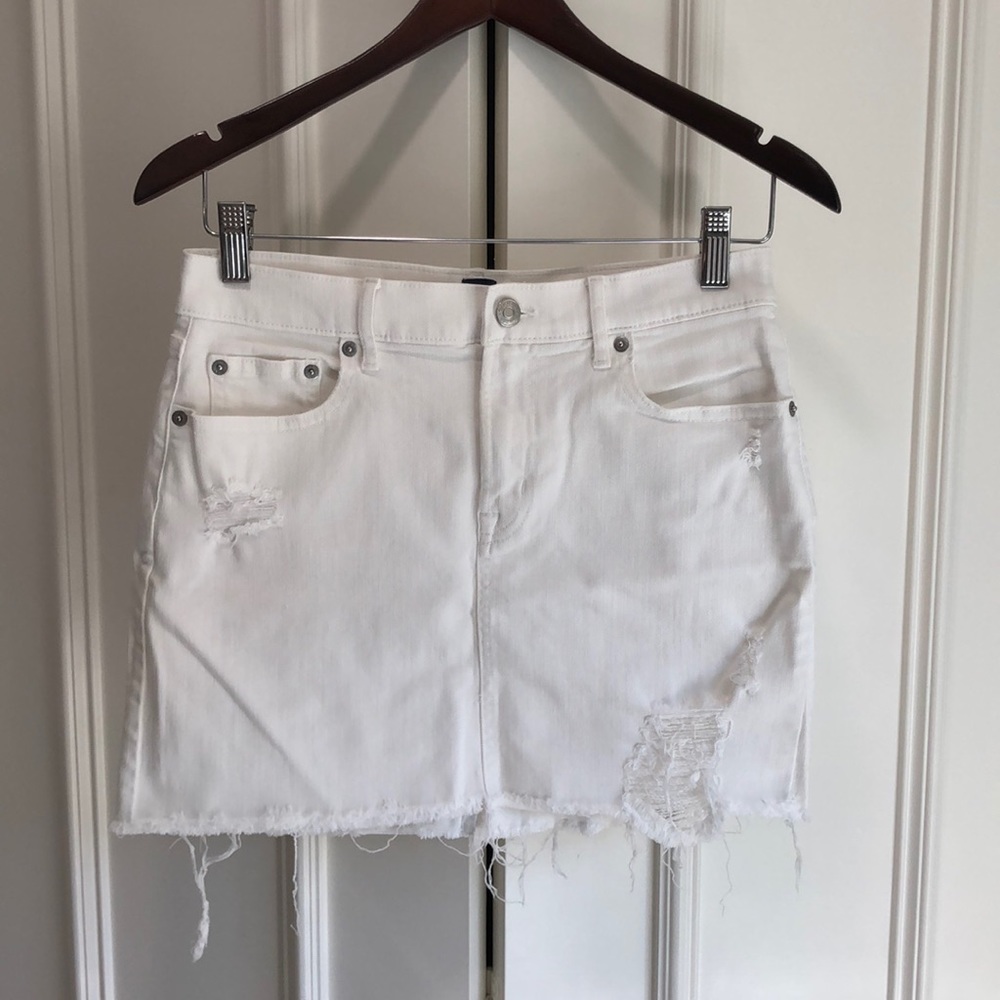 White denim mini skirt from Gap. Fringe.